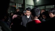 President of the Republic of Madagascar Andry Rajoelina (C) talks with families of victims at Joseph Ravoahangy Andrianavalona Hospital (HJRA) in Antananarivo late on June 26, 2019.  AFP/ Rijasolo 