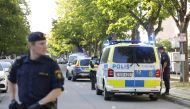 Picture dated June 30, 2019 shows police at the scene where two young men were shot in Sollentuna, north of Stockholm, Sweden. Sweden OUT / AFP / TT NEWS AGENCY / TT News Agency / Christine Olsson