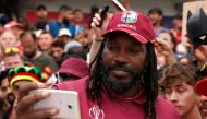 West Indies' Chris Gayle poses for a photo with fans as he celebrates after the match Action Images via Reuters/Lee Smith