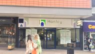 Women pass by the Hanley Economic Building Society branch in Stoke-on-Trent, Britain June 18, 2019. Reuters/Lawrence White