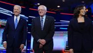 Joe Biden, Bernie Sanders and Kamala Harris pose before the start of the second US 2020 presidential election Democratic candidates debate in Miami, June 27, 2019. Reuters/Carlo Allegri