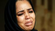 A Sudanese woman reacts during celebration following Sudan's ruling military council and a coalition of opposition and protest groups reached an agreement to share power during a transition period leading to elections, in Khartoum, Sudan July 5, 2019. Reu