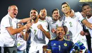 Algerian players celebrate after winning the 2019 Africa Cup of Nations (CAN) Round of 16 football match between Algeria and Guinea at the 30 June Stadium in the Egyptian capital Cairo on July 7, 2019. AFP / Khaled Desouki