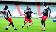 Al Duhail’s Japanese international player Shoya Nakajima passes the ball to team-mate Almoez Ali (right) during a training session held in Tehran, Iran, in this file picture.