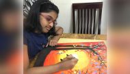 Serah working on one of her nature paintings. 