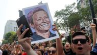 A fan holds up a sign of Megan Rapinoe of the U.S. during the parade. Reuters/Mike Segar