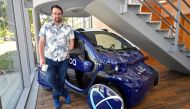 Paul Newman, co-founder of Oxbotica, stands next to an early iteration of an autonomously driven vehicle, at their company headquarters in Oxford, Britain, June 27, 2019. Reuters/Toby Melville