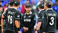 New Zealand's captain Kane Williamson (C) and teammates wait for a review decision during the 2019 Cricket World Cup first semi-final between New Zealand and India at Old Trafford in Manchester, northwest England, on July 10, 2019. AFP / Dibyangshu Sarkar