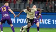 Manchester Paul Pogba (C) fights for the ball with Perth Glory's Chris Harold (L) and Gabriel Popovic (R) during their pre-season friendly match at Optus Stadium in Perth on July 13, 2019. (AFP / TONY ASHBY)