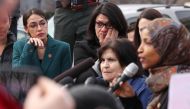 Alexandria Ocasio-Cortez and Rashida Tlaib wipe away tears as Ilhan Omar talks about her own experience as a refugee in Washington, February 7, 2019/ Reuters/Jonathan Ernst