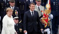German Chancellor Angela Merkel and French President Emmanuel Macron attend the traditional Bastille Day military parade on the Champs-Elysees Avenue in Paris, France, July 14, 2019. Reuters/Charles Platiau