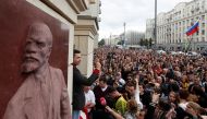 Russian opposition figure Ilya Yashin addresses his supporters, next to a bas-relief of Soviet state founder Vladimir Lenin, at a rally to protest against alleged violations ahead of elections to Moscow City Duma, the capital's regional parliament, in Mos