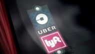 Uber and Lyft signs are seen on a car in Redondo Beach, California, March 25, 2019. Reuters / Lucy Nicholson