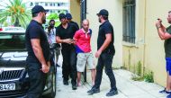 Plain-clothes police officers escort the suspect (C) for the murder of American biologist Suzanne Eaton to the prosecutor in Chania, on the island of Crete, Greece, July 16, 2019. Reuters/Makis Kartsonakis