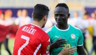 Youssef Msakni (L) of Tunisia greets with Sadio Mane (R) of Senegal ahead of the 2019 Africa Cup of Nations semifinal football match between Tunisia and Senegal, on July 14, 2019 in Cairo, Egypt. ( Samer Abdallah - Anadolu Agency )