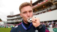 England's Jason Roy with his medal during the celebrations (Action Images via Reuters/Andrew Boyers) 
