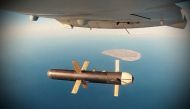 An Iranian Shahed 171 drone dropping a bomb as part of a military exercise in the Gulf, in Iran, in this undated handout photo. Tasnim News Agency/via Reuters