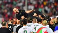 Algeria's coach Djamel Belmadi celebrates after winning the 2019 Africa Cup of Nations (CAN) Final football match between Senegal and Algeria at the Cairo International Stadium in Cairo on July 19, 2019. / AFP / Giuseppe CACACE