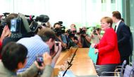 German Chancellor Angela Merkel (R) faces photographers at the start of her summer press conference at Federal Press Conference in Berlin, Germany on July 19, 2019. (Cüneyt Karada? - Anadolu Agency)