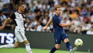 Tottenham Hotspur's Harry Kane (R) kicks the ball during the International Champions Cup football match between Juventus and Tottenham Hotspur in Singapore on July 21, 2019. / AFP / Roslan Rahman