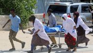:Nurses at the Medina hospital assist a civilian wounded in an explosion outside a hotel near the international airport in Mogadishu, Somalia July 22, 2019. (REUTERS/Feisal Omar)