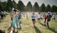People cool off as they enjoy a water fight on the Malieveld, in The Hague city center, on July 24, 2019, during a heatwave. Belgium and the Netherlands recorded their highest ever temperatures as a European heatwave neared its peak on July 24. (AFP / ANP