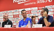 FC Barcelona's Spanish head coach Ernesto Valverde (R) speaks while Barcelona's Sergio Busquets (C) and Vissel Kobe's Andres Iniesta (L) look on during a pre-match press conference ahead of the Rakuten Cup football match between Vissel Kobe and FC Barcelo