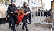 Police officers detain a protester during an unauthorised rally demanding independent and opposition candidates be allowed to run for office in local election in September, in downtown Moscow on July 27, 2019. (AFP / Maxim ZMEYEV)