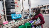 Women wash their hands in Goma on July 31, 2019.  AFP / PAMELA TULIZO