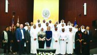 Officials and graduates of the International Executive Master’s in Emergency and Disaster Management (IEDM) degree programme pose for a group photo at Georgetown University in Qatar. 