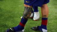General view of tattoos on legs of Barcelona's Lionel Messi REUTERS/Albert Gea