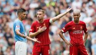Manchester City's Rodri reacts as Liverpool's Jordan Henderson and Fabinho react REUTERS/David Klein