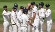 Australia's Nathan Lyon celebrates the wicket of England's Joe Denly with teammates (Reuters/Carl Recine)