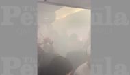 A smoke-filled cabin of British Airways aircraft is seen before an emergency disembark in Valencia, Spain August 5, 2019 in this still image obtained from social media video. Twitter/Gayle Fitzpatrick/via REUTERS 