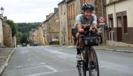 German cancer researcher from Heidelberg Fiona Kolbinger, 24, rides her bicycle on August 5, 2019 near the village of Teillay, Brittany, on her way to be the first woman to win the 2,500 miles ultra-endurance cycling Transcontinental Race from Bulgaria to
