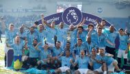 Manchester City players pose with the trophy as they celebrate winning the Premier League (Reuters/John Sibley)