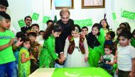 The Ambassador cutting a cake with children as part of the celebrations.