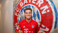 Brazilian midfielder Philippe Coutinho, new recruit of German first division Bundesliga football club FC Bayern Munich, poses in front of Bayern Munich's logo at the club's grounds in Munich, southern Germany, on August 18, 2019.
