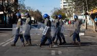 Police officers patrol near Tredgold Magistrates courts on August 19, 2019, in Bulawayo, Zimbabwe. AFP / Zinyange Auntony