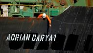 A crew member takes pictures with a mobile phone on Iranian oil tanker Adrian Darya 1, previously named Grace 1, as it sits anchored after the Supreme Court of the British territory lifted its detention order, in the Strait of Gibraltar, Spain, August 18,