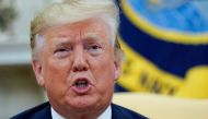 U.S. President Donald Trump answers questions from reporters as he meets with Romania's President Klaus Iohannis in the Oval Office of the White House In Washington, U.S. August 20, 2019. REUTERS/Kevin Lamarque