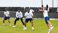 (From left) Cheteshwar Pujara, KL Rahul and Rohit Sharma watch Ajinkya Rahane (R) of India catch the ball during a training session one day ahead of the 1st Test between West Indies and India at Vivian Richards Cricket Stadium, North Sound, Antigua, on Au