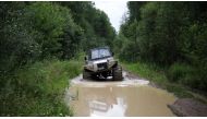 Postwoman Galina Yermolova with her husband drive their homemade off-road vehicle in a forest outside the village of Pikhtovskiy on August 3, 2019. AFP / Alexei Malgavko 