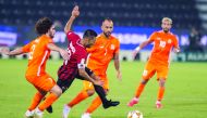 Al Rayyan skipper Rodrigo Tabata (centre) is challenged by Umm Salal players during their QNB Stars League match played at the Al Sadd Stadium, yesterday. 
