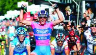 In this file photograph taken on May 8, 2011, Italian sprinter Alessandro Petacchi of the Lampre team celebrates as he crosses the finish line of the second stage of the 94th Giro d'Italia, from Alba to Parma in Parma.  AFP / Luk Benies

