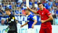 Bayern Munich's Polish forward Robert Lewandowski celebrates scoring the opening goal from the penalty spot during the German first division Bundesliga football match FC Schalke 04 FC Bayern Munich in Gelsenkirchen, western Germany on August 24, 2019. AFP