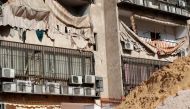 This picture taken on August 25, 2019, shows damage to a building housing a media centre of the Lebanese Shiite group Hezbollah in the south of the capital Beirut, after two drones came down in its vicinity earlier in the day. AFP / ANWAR AMRO