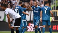 Juventus' Italian defender Giorgio Chiellini (2ndR) celebrates after opening the scoring during the Italian Serie A football match Parma vs Juventus on August 24, 2019 at the Ennio-Tardini stadium in Parma. / AFP / Marco Bertorello