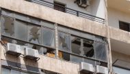 Broken windows are pictured after an Israeli drone fell in the Hezbollah-dominated southern suburbs and a second one exploded near the ground in Dahiyeh suburbs of Beirut, Lebanon August 25, 2019. REUTERS/Mohamed Azakir