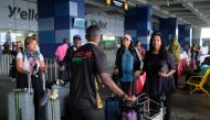 Tani Sanchez and her daughter Tani Sylvester are welcomed by a tour guide upon their arrival with other members of a heritage tour group at Ghana's Kotoka International Airport, Ghana August 6, 2019. Reuters/Francis Kokoroko